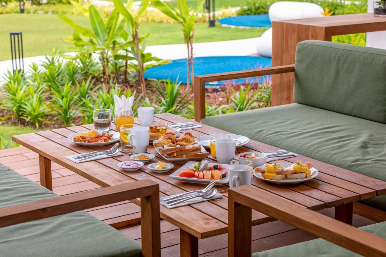 Outrigger Khao Lak Beach Resort - Sha Extra Plus Exterior foto A breakfast table
