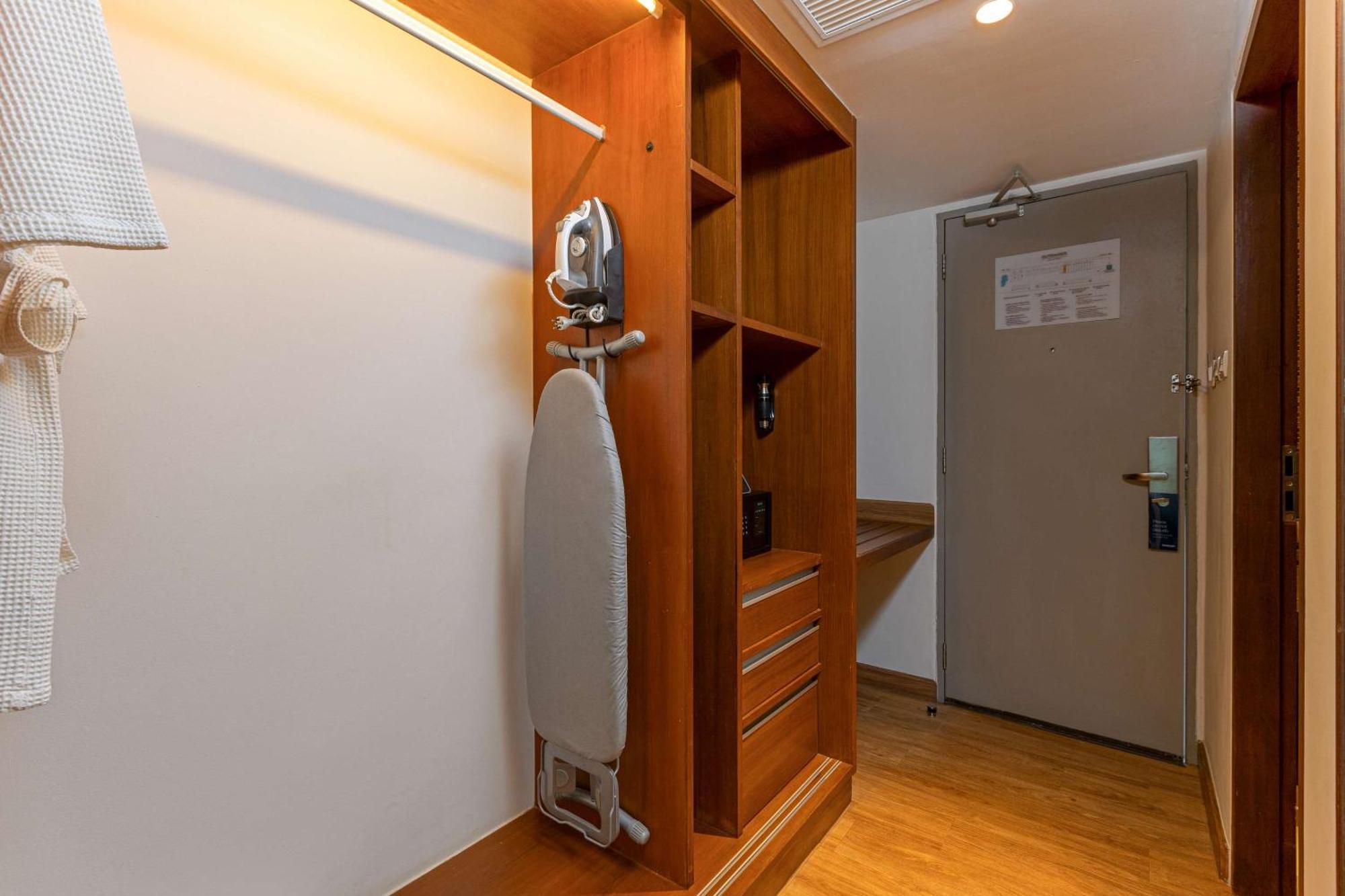 Outrigger Khao Lak Beach Resort - Sha Extra Plus Exterior foto A steam iron and ironing board in a hotel room